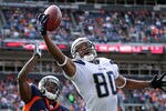 DENVER, CO - OCTOBER 09:  Malcom Floyd #80 of the San Diego Chargers makes a one handed catch out of bounds in the end zone against Andre' Goodman #21 of the Denver Broncos at Sports Authority Field at Mile High on October 9, 2011 in Denver, Colorado.  (Photo by Doug Pensinger/Getty Images)