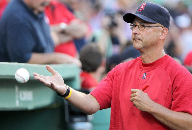 BOSTON, MA - AUGUST 26:  Terry Francona of the Boston Red Sox signs autograph before a game against the Oakland Athletics at Fenway Park August 26, 2011 in Boston, Massachusetts. (Photo by Jim Rogash/Getty Images)