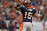 DENVER, CO - OCTOBER 09:  Quarterback Tim Tebow #15 of the Denver Broncos delivers a pass against the San Diego Chargers at Sports Authority Field at Mile High on October 9, 2011 in Denver, Colorado. The Chargers defeated the Broncos 29-24.  (Photo by Doug Pensinger/Getty Images)