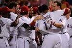 ARLINGTON, TX - OCTOBER 10:  Nelson Cruz #17 of the Texas Rangers hugs David Murphy #7 after hitting a walk off grand slam home run in the bottom of the 11th inning to win Game Two of the American League Championship Series 7-3 against the Detroit Tigers at Rangers Ballpark in Arlington on October 10, 2011 in Arlington, Texas.  (Photo by Kevork Djansezian/Getty Images)