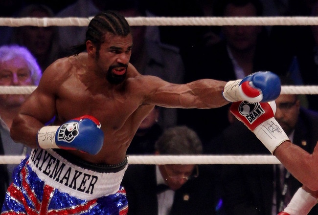 HAMBURG, GERMANY - JULY 02:  David Haye of England jabs Wladimir Klitschko of the Ukraine during their heavy weight unification match at the Imtech Arena on July 2, 2011 in Hamburg, Germany.  (Photo by Scott Heavey/Getty Images)
