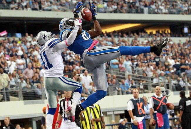 ARLINGTON, TX - OCTOBER 02:  Calvin Johnson #81 of the Detroit Lions makes a touchdown pass reception for the win over Terence Newman #41 of the Dallas Cowboys at Cowboys Stadium on October 2, 2011 in Arlington, Texas. The Lions defeated the Cowboys 34-30.  (Photo by Ronald Martinez/Getty Images)