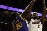 MIAMI, FL - JANUARY 01:  Forward LeBron James #6 of the Miami Heat scores againts forward Ekpe Udoh #20 of the Golden State Warriors at American Airlines Arena on January 1, 2011 in Miami, Florida.  NOTE TO USER: User expressly acknowledges and agrees that, by downloading and/or using this Photograph, User is consenting to the terms and conditions of the Getty Images License Agreement.  (Photo by Marc Serota/Getty Images)