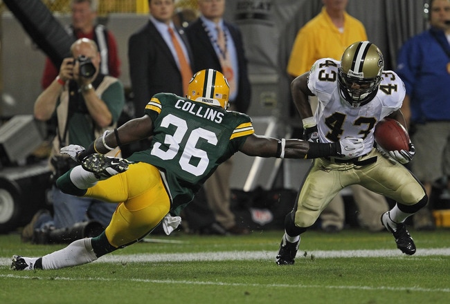 GREEN BAY, WI - SEPTEMBER 08:  Darren Sproles #43 of the New Orleans Saints tries to move around Nick Collins #36 of the Green Bay Packers during the NFL opening season game at Lambeau Field on September 8, 2011 in Green Bay, Wisconsin. The Packers defeated the Saints 42-34.  (Photo by Jonathan Daniel/Getty Images)