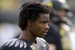 EUGENE, OR - NOVEMBER 6: Cornerback Cliff Harris #13 of the Oregon Ducks warms up before the game against the Washington Huskies at Autzen Stadium on November 6, 2010 in Eugene, Oregon. (Photo by Steve Dykes/Getty Images)