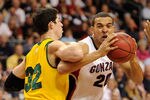 LAS VEGAS, NV - MARCH 06:  Elias Harris #20 of the Gonzaga Bulldogs drives into Angelo Caloiaro #32 of the San Francisco Dons during a semifinal game of the Zappos.com West Coast Conference Basketball tournament at the Orleans Arena March 6, 2011 in Las Vegas, Nevada. Gonzaga won 71-67.  (Photo by Ethan Miller/Getty Images)