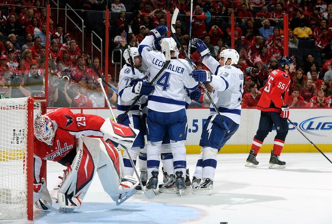 WASHINGTON, DC - OCTOBER 10:  Brett Clark #7 of the Tampa Bay Lightning celebrates with teammates after scoring in the third period against the Washington Capitals at the Verizon Center on October 10, 2011 in Washington, DC.  (Photo by Greg Fiume/Getty Images)