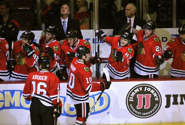 CHICAGO, IL - OCTOBER 08: Patrick Sharp #10 of the Chicago Blackhawks celebrates his goal against the Dallas Stars  with his teammates during the third period on October 8, 2011 at the United Center in Chicago, Illinois. The Blackhawks defeated the Stars 5-2.  (Photo by David Banks/Getty Images)