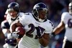 FOXBORO, MA - JANUARY 10:  Ray Rice #27 of the Baltimore Ravens runs the ball against the New England Patriots during the 2010 AFC wild-card playoff game at Gillette Stadium on January 10, 2010 in Foxboro, Massachusetts.  (Photo by Elsa/Getty Images)