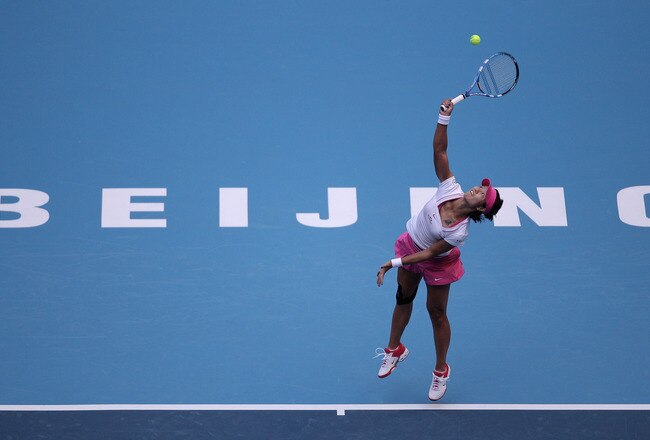 BEIJING, CHINA - OCTOBER 02:  Na Li of China serves a shot to Monica Niculescu of Romania during day two of the China Open at the National Tennis Center on October 2, 2011 in Beijing, China.  (Photo by Feng Li/Getty Images)
