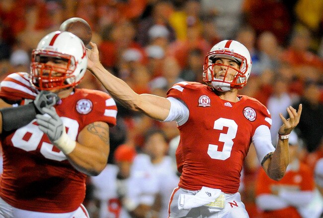 LINCOLN, NE - OCTOBER 8: Quarterback Taylor Martinez #3 of the Nebraska Cornhuskers throws downfield against the Ohio State defense during their game at Memorial Stadium October 8, 2011 in Lincoln, Nebraska. Nebraska Defeated Ohio State 34-27. (Photo by Eric Francis/Getty Images)