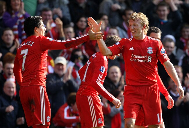 LIVERPOOL, ENGLAND - MARCH 06:  Dirk Kuyt of Liverpool celebrates scoring the opening goal with team mate Luis Suarez during the Barclays Premier League match between Liverpool and Manchester United at Anfield on March 6, 2011 in Liverpool, England.  (Photo by Alex Livesey/Getty Images)