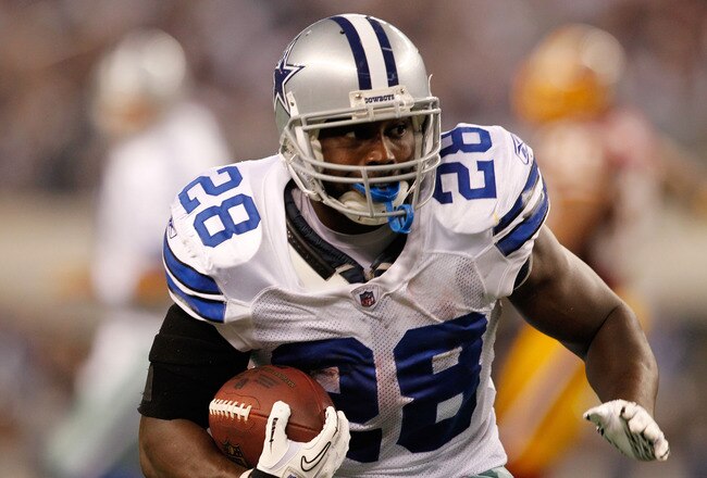 ARLINGTON, TX - SEPTEMBER 26:  Felix Jones #28 of the Dallas Cowboys runs with the ball against the Washington Redskins during their game at Cowboys Stadium on September 26, 2011 in Arlington, Texas.  (Photo by Tom Pennington/Getty Images)