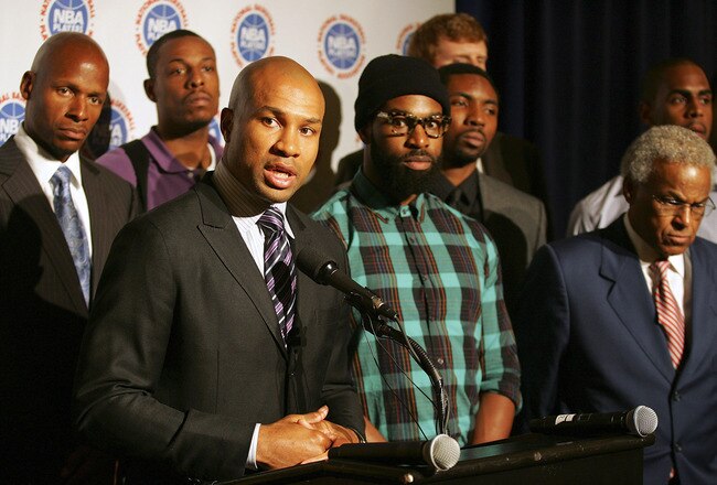 NEW YORK, NY - SEPTEMBER 30:  Derek Fisher (C), President of the National Basketball Players Association is surrounded by players and Billy Hunter NBPA Executive Director (R) as he speaks at a press conference after NBA labor negotiations at The Waldorf-Astoria on September 30, 2011 in New York City.  (Photo by Michael Cohen/Getty Images)