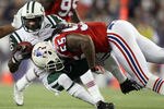 FOXBORO, MA - OCTOBER 09:  Derrick Mason #85 of the New York Jets is tackled by  Brandon Spikes #55 of the New England Patriots on October 9, 2011 at Gillette Stadium in Foxboro, Massachusetts.  (Photo by Elsa/Getty Images)