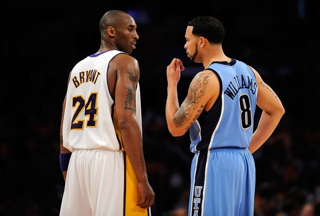 LOS ANGELES, CA - APRIL 19:  Kobe Bryant #24 of the Los Angeles Lakers talks with Deron Williams #8 of the Utah Jazz in Game One of the Western Conference Quarterfinals during the 2009 NBA Playoffs at Staples Center on April 19, 2009 in Los Angeles, California. NOTE TO USER: User expressly acknowledges and agrees that, by downloading and or using this photograph, User is consenting to the terms and conditions of the Getty Images License Agreement.  (Photo by Kevork Djansezian/Getty Images)