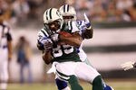 EAST RUTHERFORD, NJ - SEPTEMBER 11:  Derrick Mason #85 of the New York Jets makes a recpetion against the Dallas Cowboys during their NFL Season Opening Game at MetLife Stadium on September 11, 2011 in East Rutherford, New Jersey.  (Photo by Elsa/Getty Images)