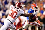 GAINESVILLE, FL - OCTOBER 01:  Dont'a Hightower #30 of the Alabama Crimson Tide attempts to tackle Chris Rainey #1 of the Florida Gators during a game at Ben Hill Griffin Stadium on October 1, 2011 in Gainesville, Florida.  (Photo by Sam Greenwood/Getty Images)