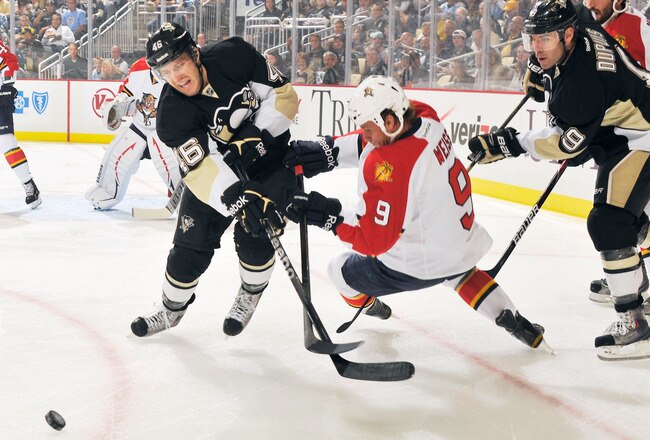 PITTSBURGH, PA - OCTOBER 11:  Joe Vitale #46 of the Pittsburgh Penguins gets tangled up with Stephen Weiss #9 of the Florida Panthers as they battle for control of the puck in the first period on October 11, 2011 at CONSOL Energy Center in Pittsburgh, Pennsylvania.  (Photo by Jamie Sabau/Getty Images)