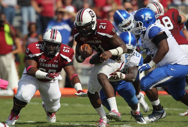 COLUMBIA, SC - OCTOBER 08:  Marcus Lattimore #21 of the South Carolina Gamecocks runs with the ball against the Kentucky Wildcats during their game at Williams-Brice Stadium on October 8, 2011 in Columbia, South Carolina.  (Photo by Streeter Lecka/Getty Images)