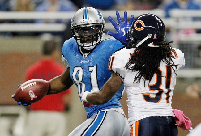 DETROIT, MI - OCTOBER 10:  Calvin Johnson #81 of the of the Detroit Lions runs for a touchdown against Brandon Meriweather #31 of the of the Chicago Bears at Ford Field on October 10, 2011 in Detroit, Michigan.  (Photo by Gregory Shamus/Getty Images)