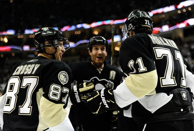 PITTSBURGH - DECEMBER 20: Sidney Crosby #87 and Evgeni Malkin #71 of the Pittsburgh Penguins celebrate a goal during their game against the Phoenix Coyotes on December 20, 2010 at the Consol Energy Center in Pittsburgh, Pennsylvania.  (Photo by Karl Walter/Getty Images)
