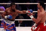 HAMBURG, GERMANY - JULY 02:  David Haye of England jabs Wladimir Klitschko of the Ukraine during their heavy weight unification match at the Imtech Arena on July 2, 2011 in Hamburg, Germany.  (Photo by Scott Heavey/Getty Images)