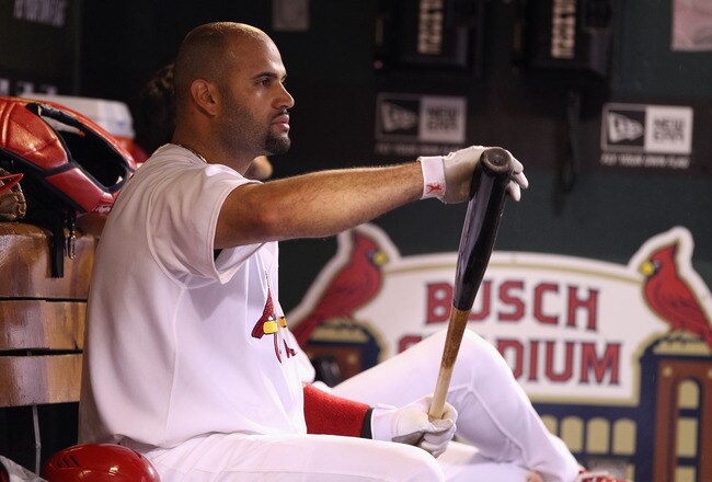 ST LOUIS, MO - OCTOBER 12:  Albert Pujols #5 of the St. Louis Cardinals looks on from the dugout against the Milwaukee Brewers during Game Three of the National League Championship Series at Busch Stadium on October 12, 2011 in St Louis, Missouri.  (Photo by Christian Petersen/Getty Images)