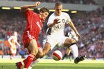 LIVERPOOL, UNITED KINGDOM - MARCH 03: Steven Gerrard of Liverpool battles for the ball with Nemanja Vidic of Manchester United during the Barclays Premiership match between Liverpool and Manchester United at Anfield on March 3, 2007 in Liverpool, England. (Photo by Clive Mason/Getty Images)
