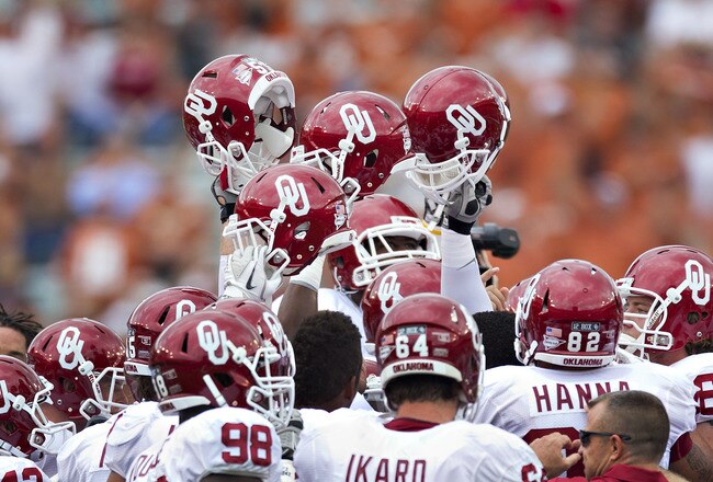 DALLAS, TX - OCTOBER 8:   Oklahoma Sooner players hold their helmets hight before a game against  the Texas Longhorns at the Cotton Bowl on October 8, 2011 in Dallas, Texas.  The Sooners defeated the Longhorns 55 to 17.  (Photo by Wesley Hitt/Getty Images)