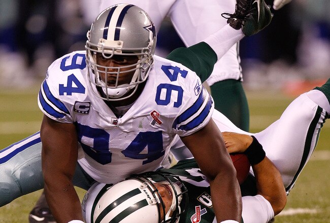 EAST RUTHERFORD, NJ - SEPTEMBER 11:  DeMarcus Ware #94 of the Dallas Cowboys sacks Mark Sanchez #6 of the New York Jets in the first half during their NFL Season Opening Game at MetLife Stadium on September 11, 2011 in East Rutherford, New Jersey.  (Photo by Jeff Zelevansky/Getty Images)