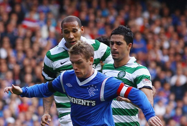 GLASGOW, SCOTLAND - SEPTEMBER 18: Steven Davis of Rangers is tackled by Beram Kayal of Celtic during the Clydesdale Bank Premier League match between Rangers and Celtic at Ibrox Stadium on September 18, 2011 in Glasgow, Scotland.   (Photo by Jeff J Mitchell/Getty Images)