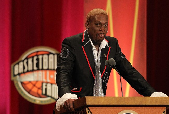 SPRINGFIELD, MA - AUGUST 12:   Dennis Rodman gestures during the Basketball Hall of Fame Enshrinement Ceremony at Symphony Hall on August 12, 2011 in Springfield, Massachusetts. (Photo by Jim Rogash/Getty Images)