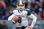 STATE COLLEGE, PA - NOVEMBER 27: Quarterback Kirk Cousins #8 of the Michigan State Spartans scrambles out of the pocket during a game against the Penn State Nittany Lions on November 27, 2010 at Beaver Stadium in State College, Pennsylvania. The Spartans won 28-22. (Photo by Hunter Martin/Getty Images)