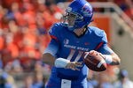 BOISE, ID - OCTOBER 01:  Kellen Moore #11 of the Boise State Broncos looks for a receiver against the Nevada Wolf Pack at Bronco Stadium on October 1, 2011 in Boise, Idaho.  (Photo by Otto Kitsinger III/Getty Images)