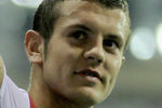 HANGZHOU, CHINA - JULY 16: Jack Wilshere of Arsenal gestures to the fans after the pre-season friendly match between Hangzhou Greentown and Arsenal at Yiwu Meihu Stadium on July 16, 2011 in Hangzhou, China. (Photo by Lintao Zhang/Getty Images)