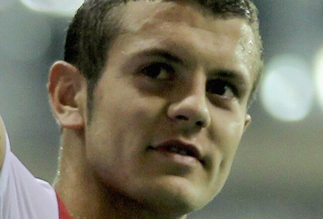 HANGZHOU, CHINA - JULY 16: Jack Wilshere of Arsenal gestures to the fans after the pre-season friendly match between Hangzhou Greentown and Arsenal at Yiwu Meihu Stadium on July 16, 2011 in Hangzhou, China. (Photo by Lintao Zhang/Getty Images)