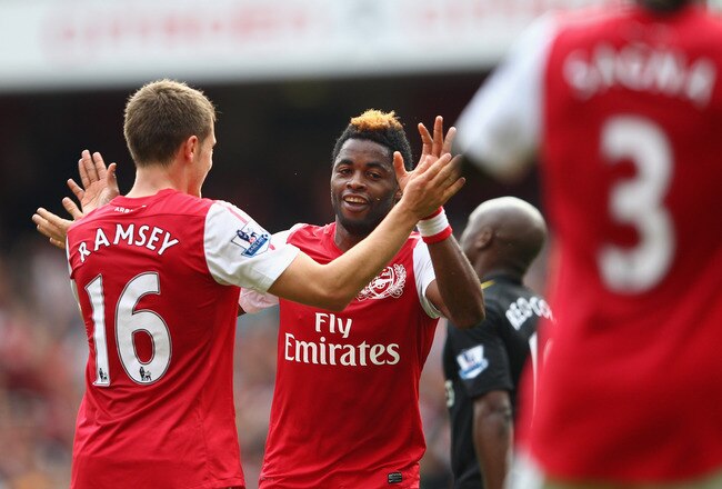 LONDON, ENGLAND - SEPTEMBER 24:  Alex Song of Arsenal celebrates his goal with team mate Bacary Sagna during the Barclays Premier League match between Arsenal and Bolton Wanderers at Emirates Stadium on September 24, 2011 in London, England.  (Photo by Clive Mason/Getty Images)