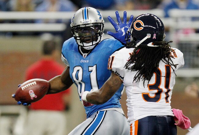 DETROIT, MI - OCTOBER 10:  Calvin Johnson #81 of the of the Detroit Lions runs for a touchdown against Brandon Meriweather #31 of the of the Chicago Bears at Ford Field on October 10, 2011 in Detroit, Michigan.  (Photo by Gregory Shamus/Getty Images)