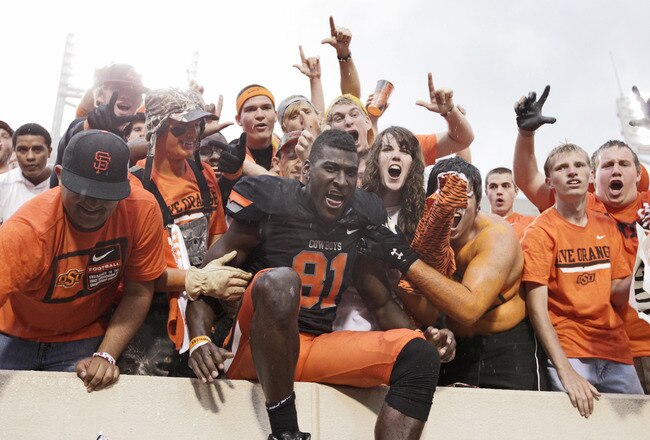 STILLWATER, OK - OCTOBER 8:  Wide receiver Justin Blackmon #81 of Oklahoma State celebrates with fans after the game against Kansas University on October 8, 2011 at Boone Pickens Stadium in Stillwater, Oklahoma.  Oklahoma State defeated Kansas 70-28.  (Photo by Brett Deering/Getty Images)