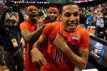 GREENSBORO, NC - MARCH 11:  Erick Green #11, Malcolm Delaney #23 and Paul Debnam #32 of the Virginia Tech Hokies celebrate their 52-51 win over the Florida State Seminoles in the quarterfinals of the 2011 ACC men's basketball tournament at the Greensboro Coliseum on March 11, 2011 in Greensboro, North Carolina. Virginia Tech won 52-51 in regulation.  (Photo by Streeter Lecka/Getty Images)