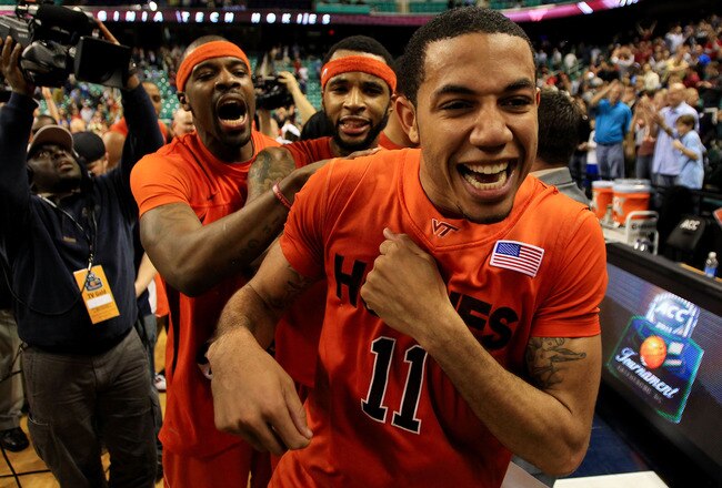GREENSBORO, NC - MARCH 11:  Erick Green #11, Malcolm Delaney #23 and Paul Debnam #32 of the Virginia Tech Hokies celebrate their 52-51 win over the Florida State Seminoles in the quarterfinals of the 2011 ACC men's basketball tournament at the Greensboro Coliseum on March 11, 2011 in Greensboro, North Carolina. Virginia Tech won 52-51 in regulation.  (Photo by Streeter Lecka/Getty Images)