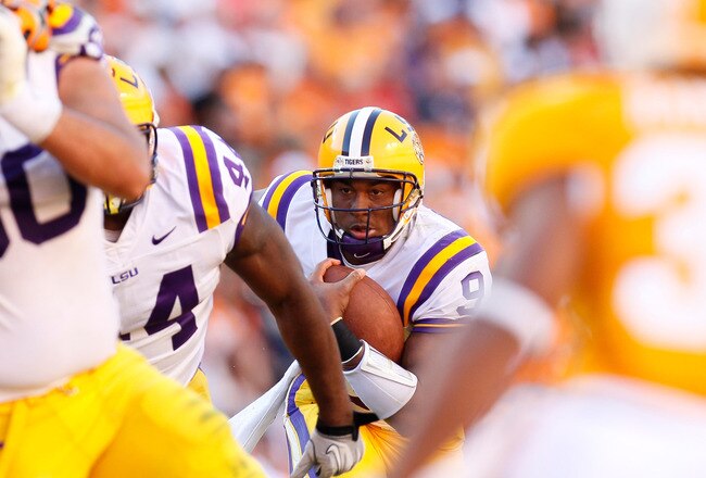 KNOXVILLE, TN - OCTOBER 15:  Jordan Jefferson #9 of the LSU Tigers looks for an opening in the line as he rushes against the Tennessee Volunteers at Neyland Stadium on October 15, 2011 in Knoxville, Tennessee.  (Photo by Kevin C. Cox/Getty Images)