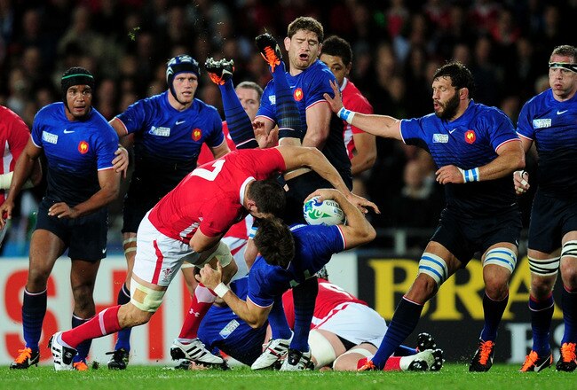 AUCKLAND, NEW ZEALAND - OCTOBER 15:  Sam Warburton of Wales upends wing Vincent Clerc of France during semi final one of the 2011 IRB Rugby World Cup between Wales and France at Eden Park on October 15, 2011 in Auckland, New Zealand.  (Photo by Stu Forster/Getty Images)