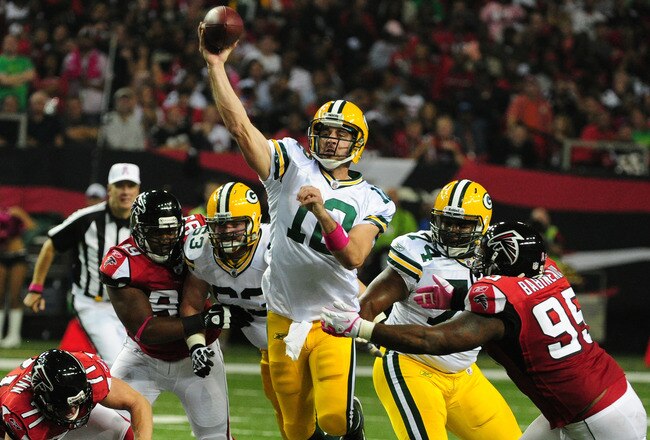 ATLANTA, GA - OCTOBER 9: Aaron Rodgers #12 of the Green Bay Packers passes against the Atlanta Falcons at the Georgia Dome on October 9, 2011 in Atlanta, Georgia. (Photo by Scott Cunningham/Getty Images)