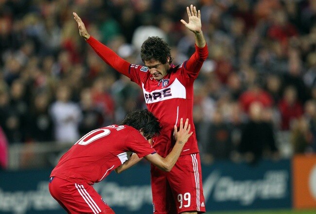 WASHINGTON, DC - OCTOBER 15: Diego Chaves #99 and Sebastian Grazzini #10 of Chicago Fire celebrate after a goal against D.C. United at RFK Stadium on October 15, 2011 in Washington, DC. (Photo by Ned Dishman/Getty Images)