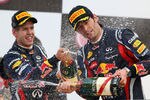 YEONGAM-GUN, SOUTH KOREA - OCTOBER 16:  Race winner Sebastian Vettel (L) of Germany and Red Bull Racing celebrates on the podium with third placed team mate Mark Webber of Australia and Red Bull Racing following the Korean Formula One Grand Prix at the Korea International Circuit on October 16, 2011 in Yeongam-gun, South Korea.  (Photo by Clive Mason/Getty Images)