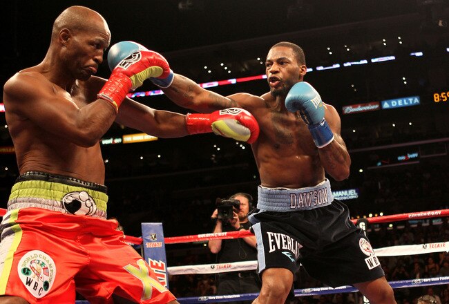 LOS ANGELES, CA - OCTOBER 15:  Bernard Hopkins (L) and Chad Dawson exchange punches in their WBC and Ring Magzine light heavyweight title fight at Staples Center on October 15, 2011 in Los Angeles, California. Dawson was awarded a second round TKO after Hopkins injured his shoulder. (Photo by Stephen Dunn/Getty Images)