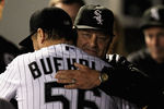 CHICAGO, IL - SEPTEMBER 27:  Starting pitcher Mark Buehrle #56 of the Chicago White Sox gets a hug from interim manager and pitching coach Don Cooper after being taken out of a game against the Toronto Blue Jays at U.S. Cellular Field on September 27, 2011 in Chicago, Illinois.  (Photo by Jonathan Daniel/Getty Images)