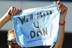 LAS VEGAS - OCTOBER 16:  A fan waves a sign after Dan Wheldon of England died of injuries after a fifteen car crash during the Las Vegas Indy 300 part of the IZOD IndyCar World Championships presented by Honda on October 16, 2011 at the Las Vegas Motor Speedway in Las Vegas, Nevada.  (Photo by Robert Laberge/Getty Images)